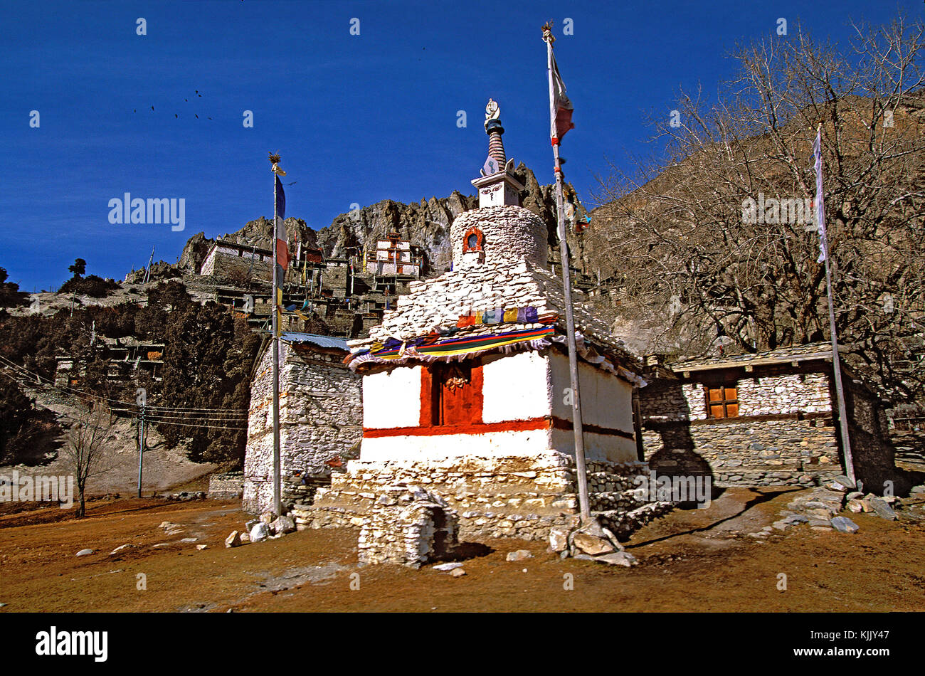 Monastery and Stupa 'Chšrten' in Braga village. Nepal. Stock Photo