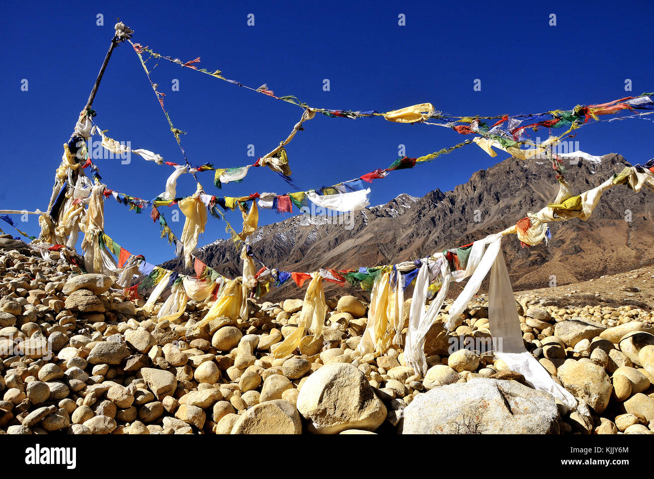 Cairn and prayer flags in Mustang. Nepal. Stock Photo