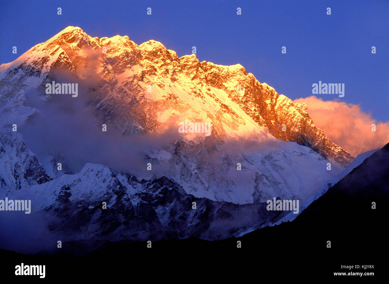 Sunset over Nuptse and Lhotse summits. Solu Khumbu.  Nepal. Stock Photo