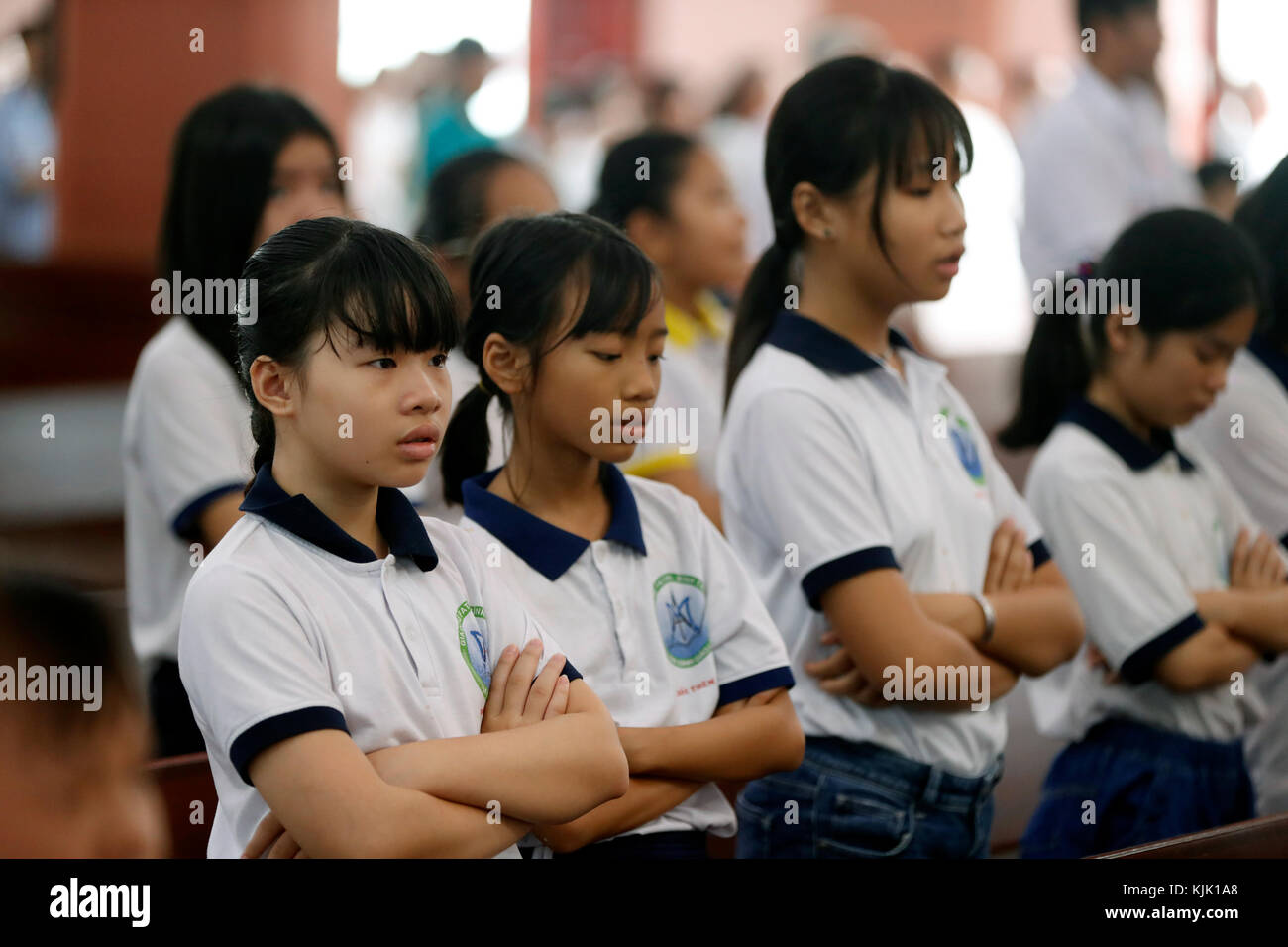Our Lady of Fatima church.  Children at Catholic mass.  Ho Chi Minh City.  Vietnam. Stock Photo
