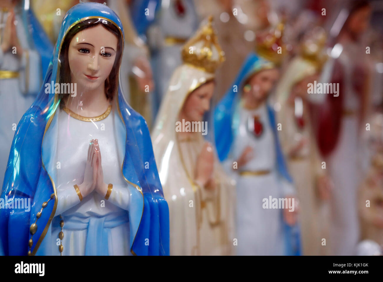 Shop selling religious christian items.  Holy Virgin statues.  Ho Chi Minh City.  Vietnam. Stock Photo