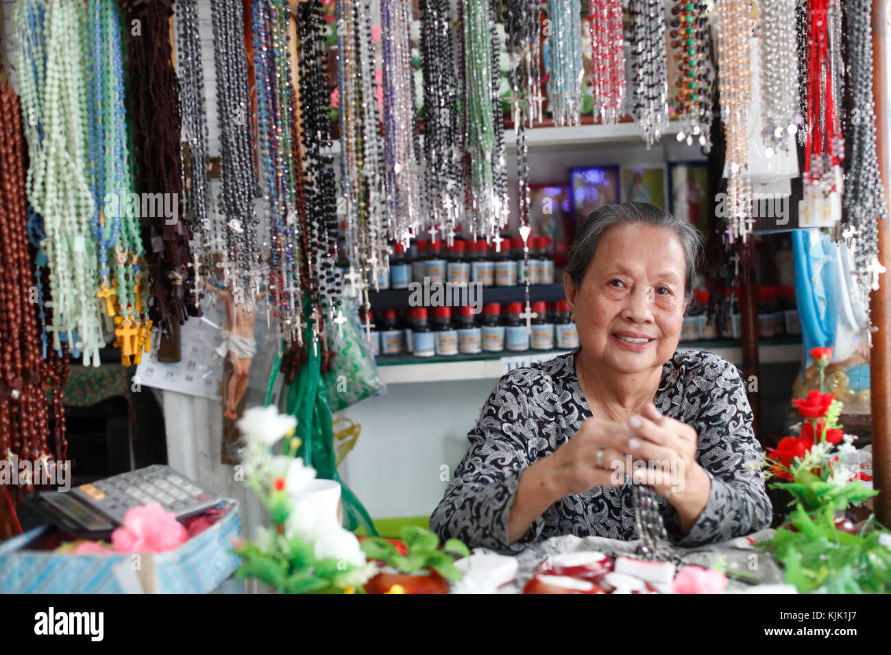 Shop selling religious christian items.  Rosary prayer beads for sale.  .  Ho Chi Minh City.  Vietnam. Stock Photo