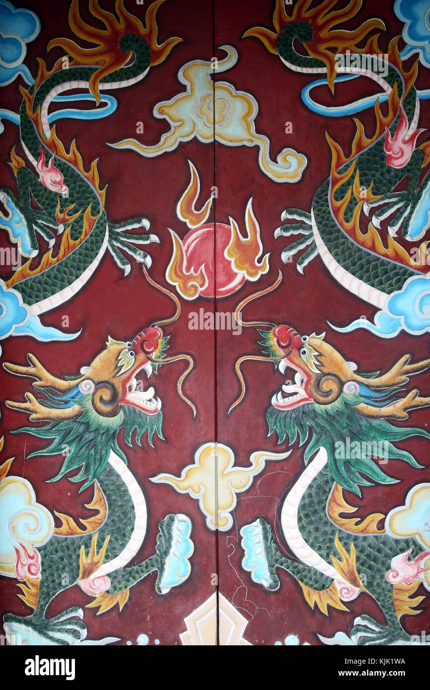 Chua Ong buddhist Pagoda. Ornate temple door with two dragons.  Hoi An. Vietnam. Stock Photo