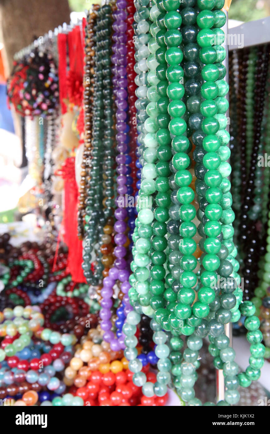 Various religious merchandise items on sale.  Danang. Vietnam. Stock Photo
