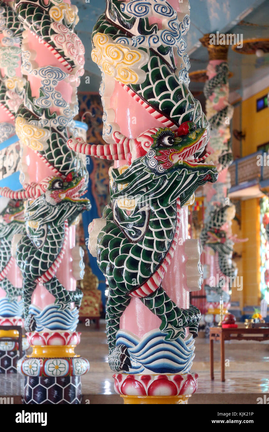 Cao Dai Holy See Temple.  Ornate dragon columns. Thay Ninh. Vietnam. Stock Photo