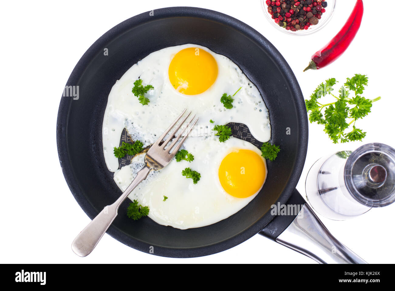 Two fried eggs on Teflon frying pan. Studio Photo Stock Photo