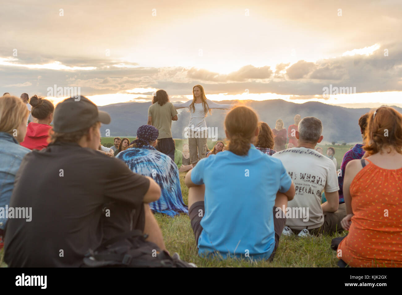 group of people in nature enjoying sunset Stock Photo