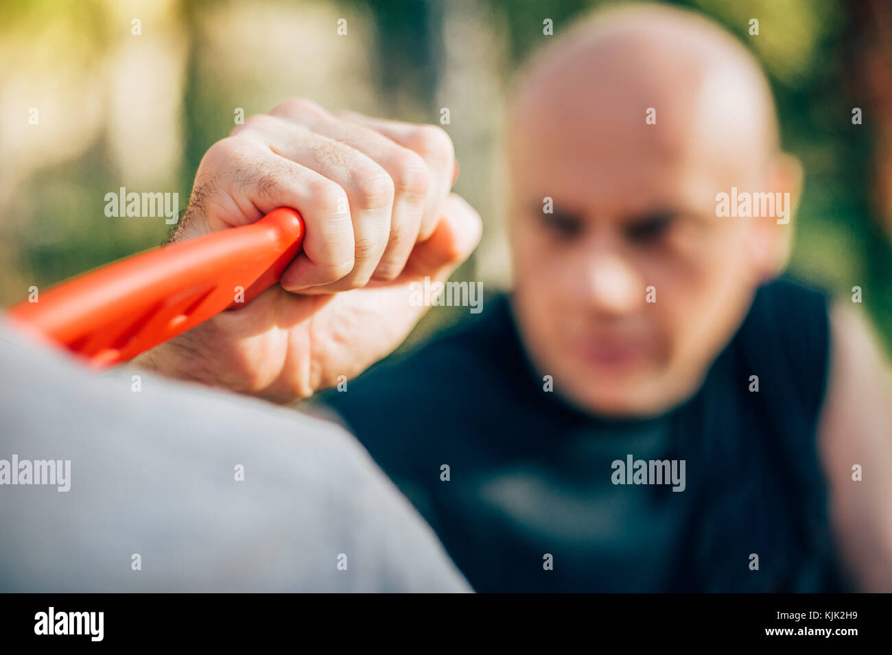 Knife threat. Kapap instructor demonstrates martial arts self defense