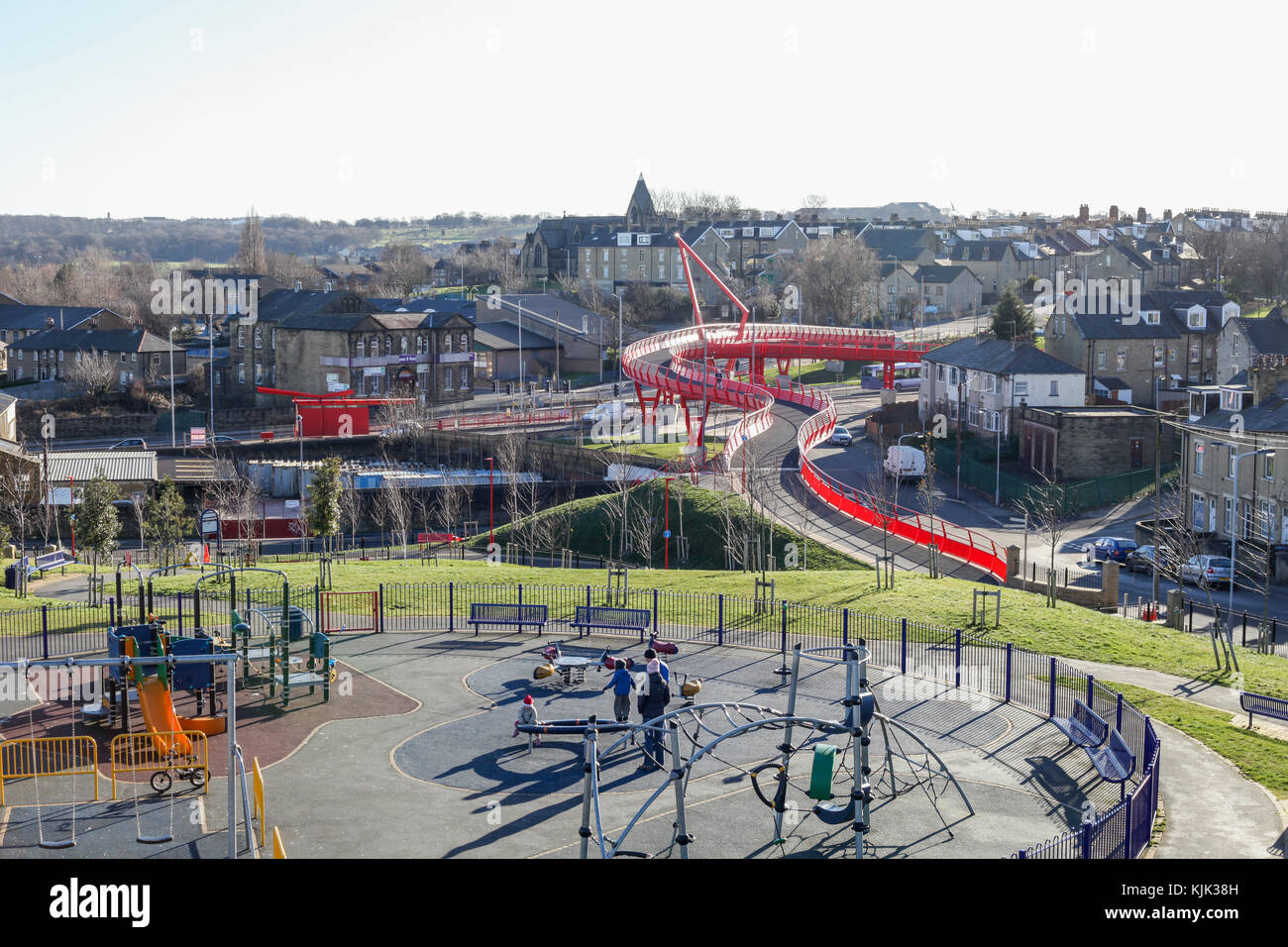 Big red bridge on Manchester rd, Bradford, West Yorkshire, pedestrian and cycle bridge in a deconstructive style. Steel built construction. Playground Stock Photo