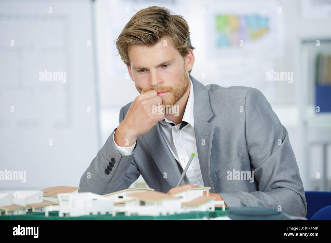 architect in front of home scale model Stock Photo - Alamy