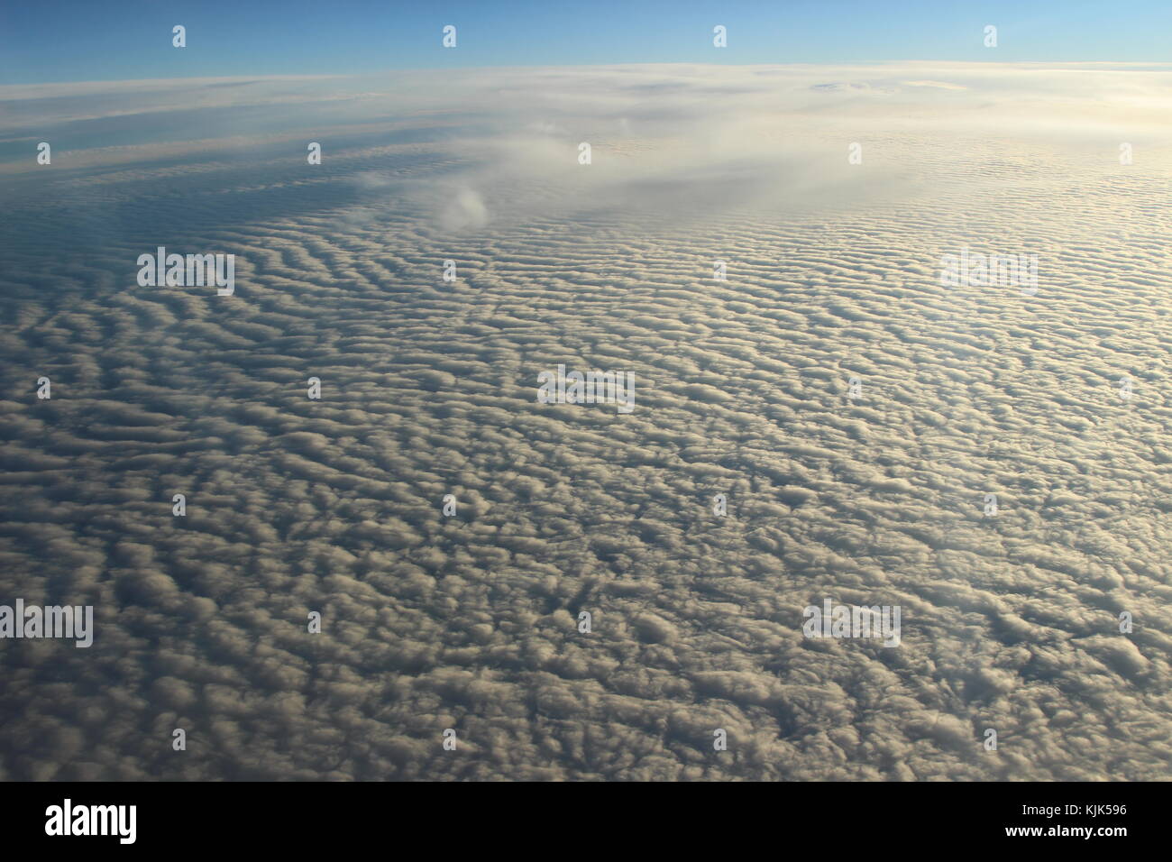 Fly in the sky with airplane over ocean and landscape Stock Photo - Alamy
