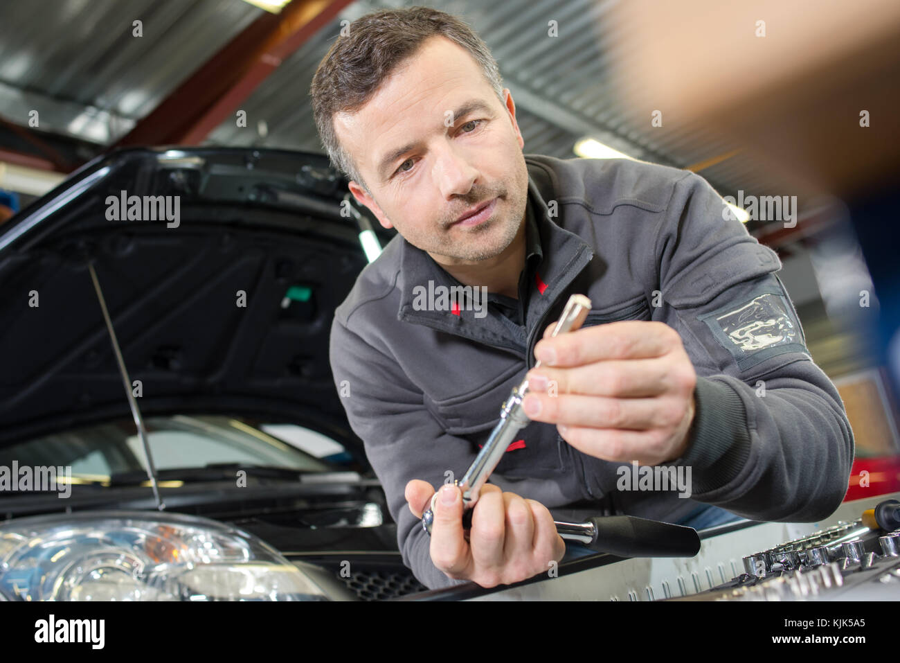 Portrait Of A Car Engineer In His Garage Stock Photo 166378413