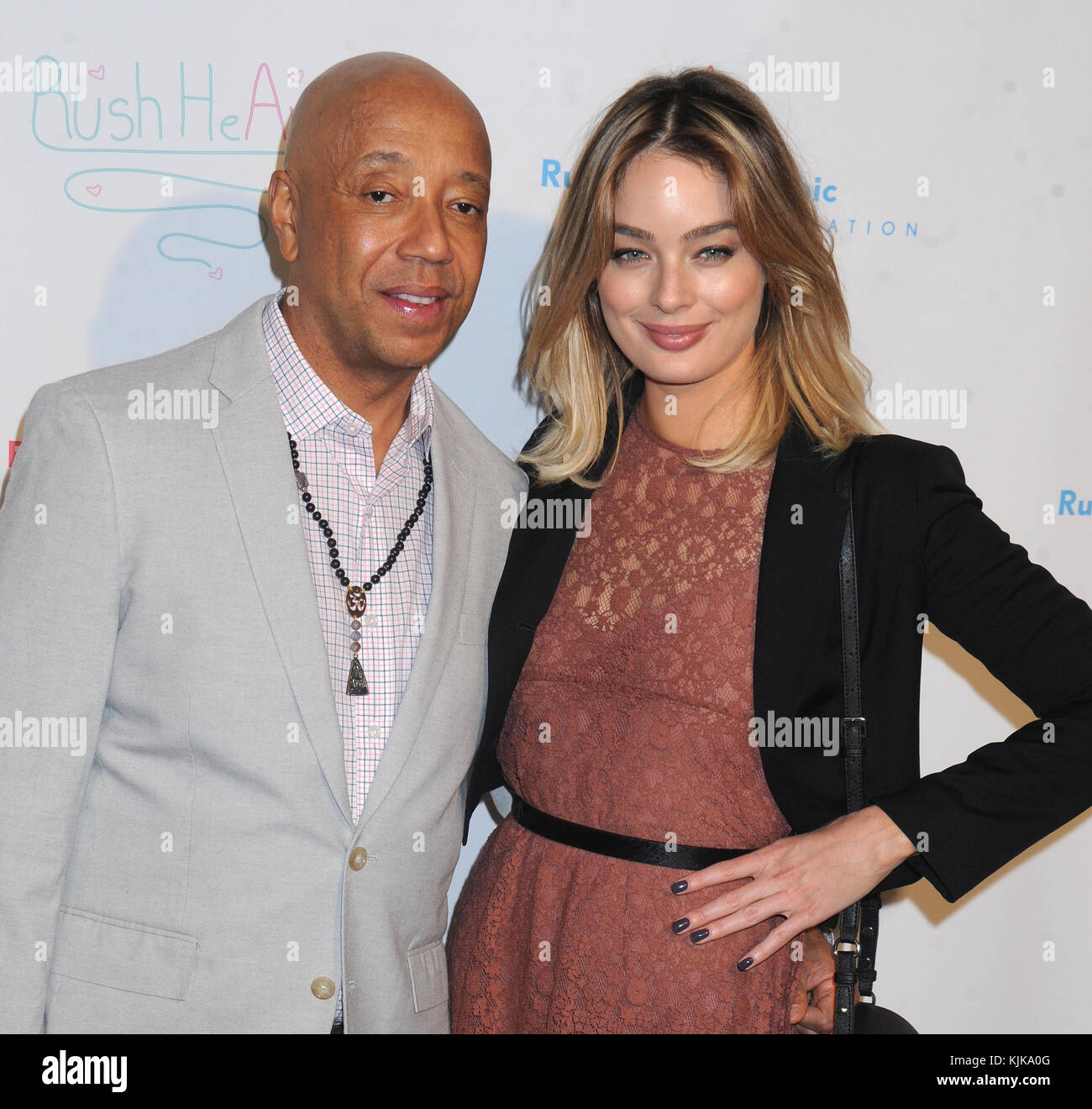 NEW YORK, NEW YORK MARCH 11 Russell Simmons, Lucy McIntosh attends the 4th Annual Russell