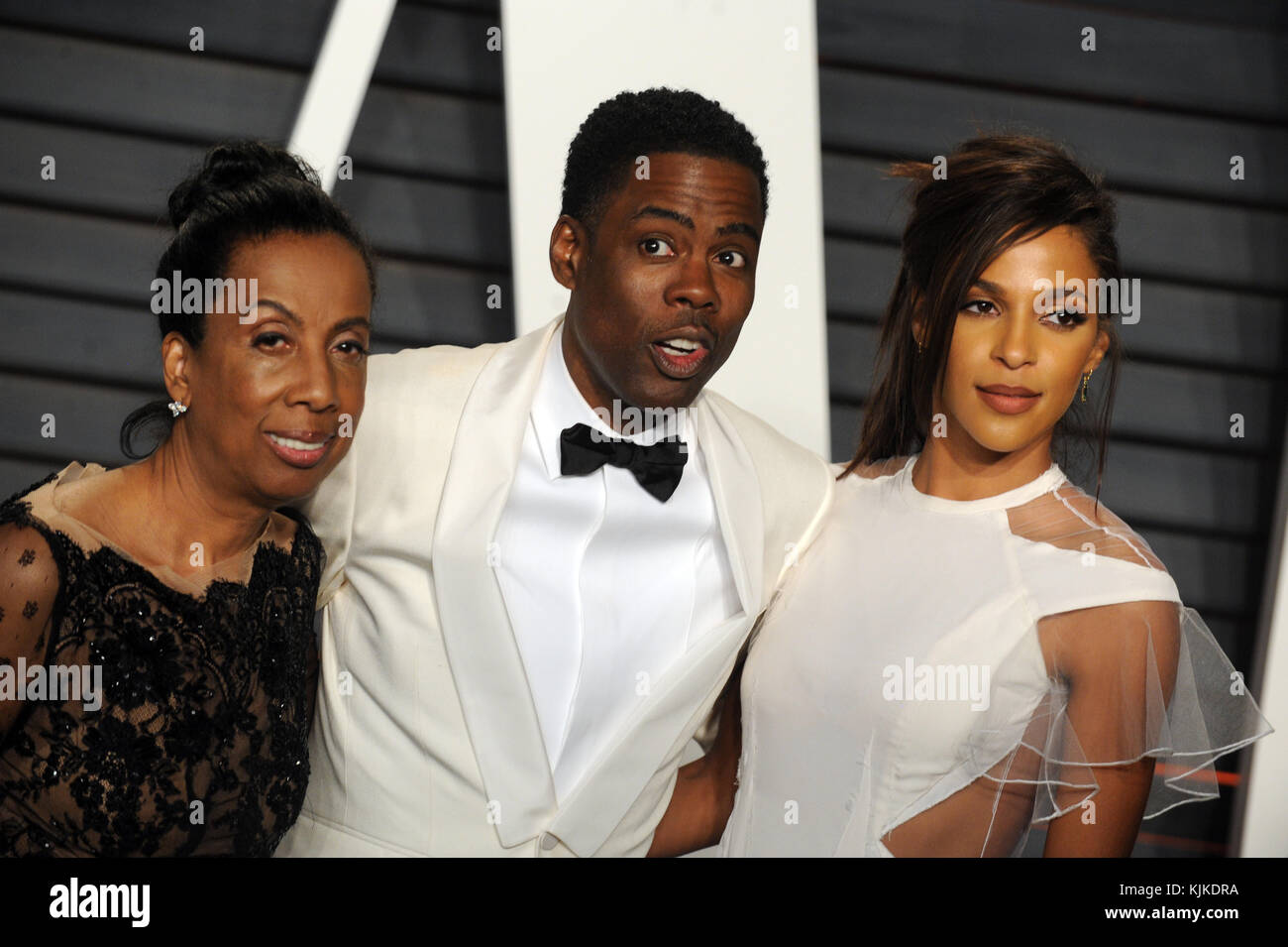 BEVERLY HILLS, CA - FEBRUARY 28: Rosalie Rock, Chris Rock,  Megalyn Echikunwoke attends the 2016 Vanity Fair Oscar Party Hosted By Graydon Carter at the Wallis Annenberg Center for the Performing Arts on February 28, 2016 in Beverly Hills, California.  People:  Rosalie Rock, Chris Rock,  Megalyn Echikunwoke Stock Photo