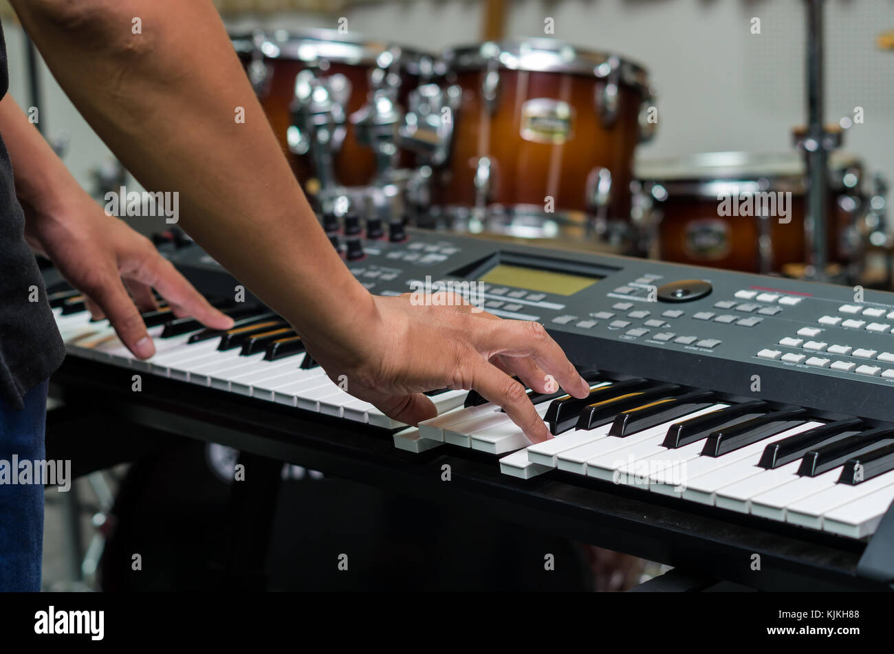 Closeup hands playing the keyboard or piano on brand music instrument ...