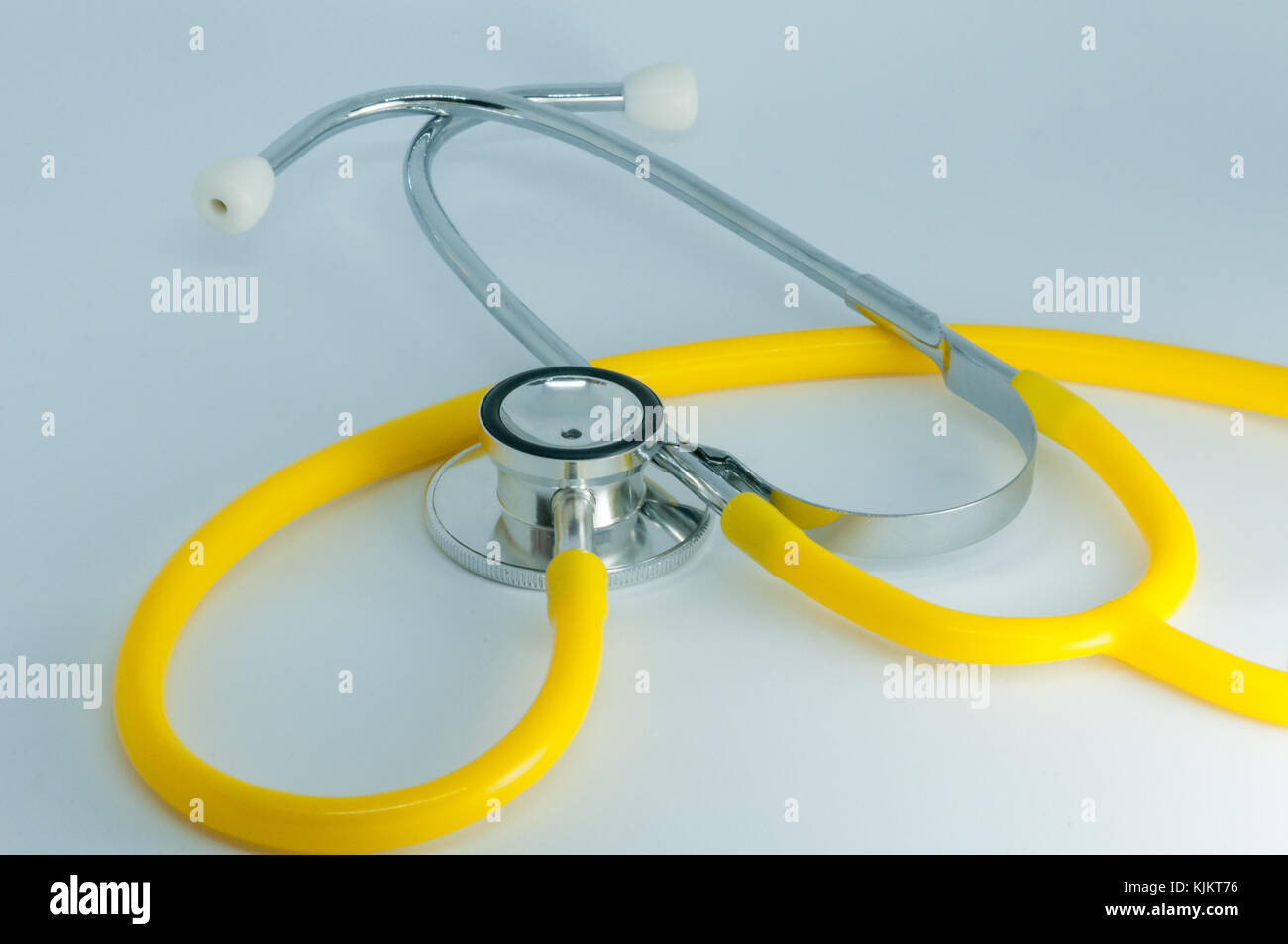 Yellow Stethoscope on a white background Stock Photo Alamy