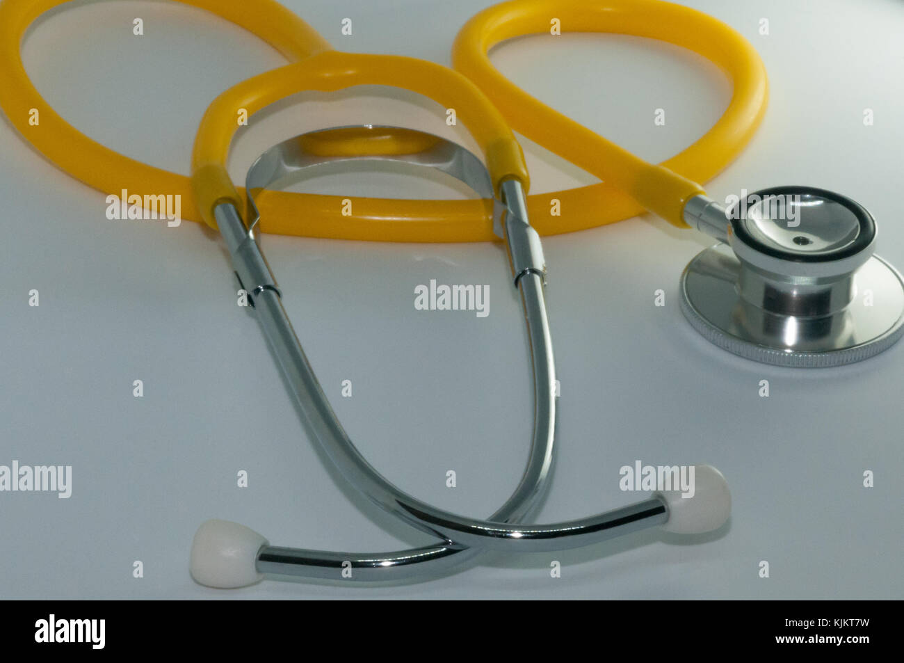 Yellow Stethoscope on a white background Stock Photo Alamy