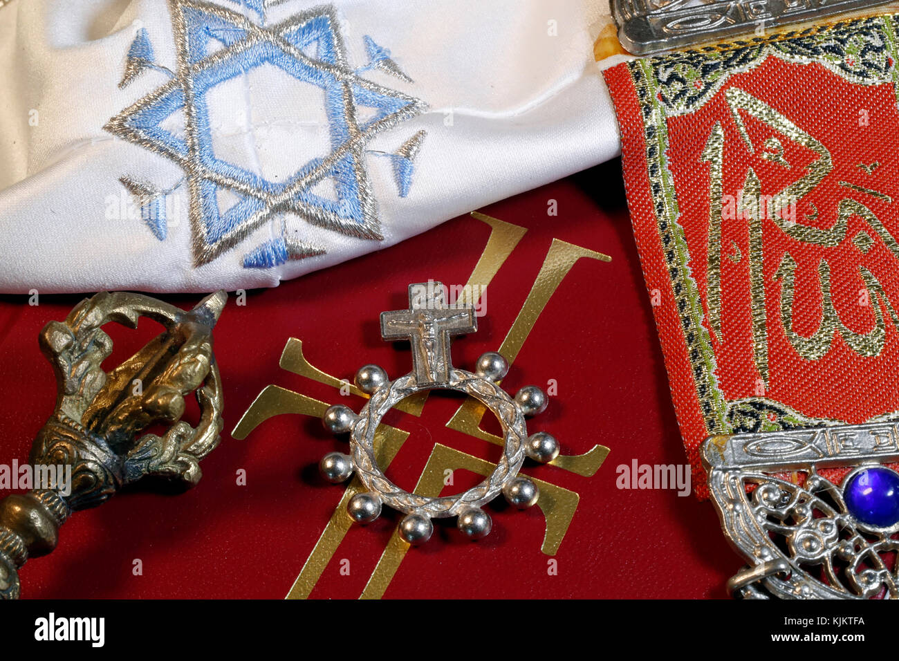 Christianity, buddhism,  Islam and Judaism. Interfaith symbols : bible, Kippah, Allah monogram  and vajra. Stock Photo