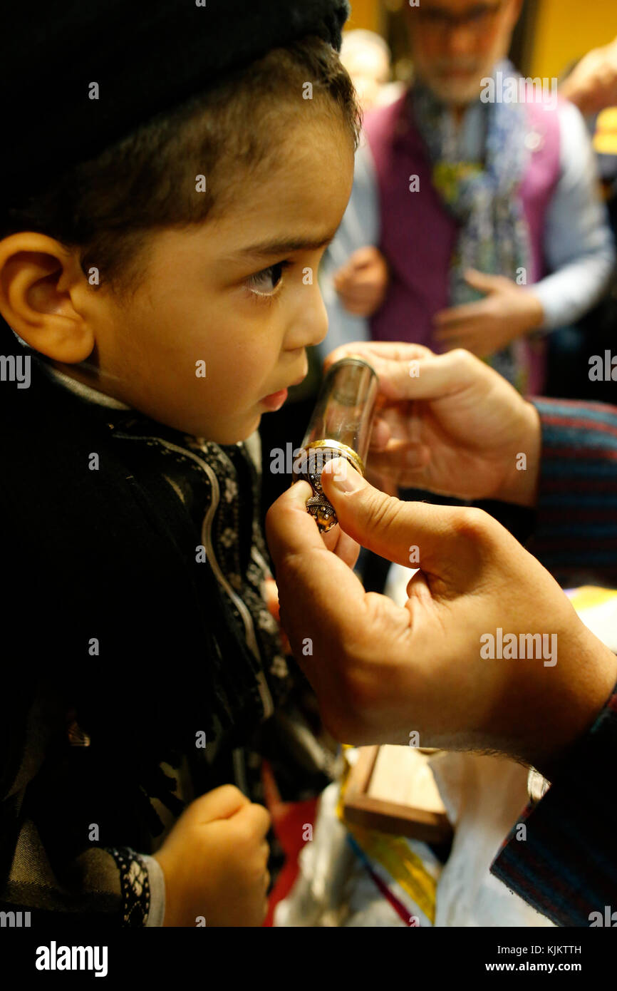 Muslim boy facing a holy relic. France. Stock Photo