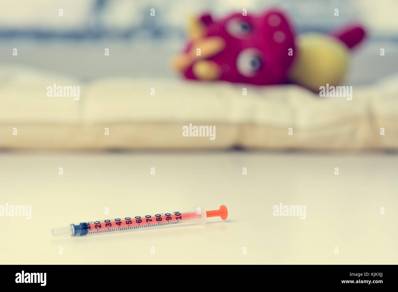 Insulin syringe on child hospital table. Stock Photo