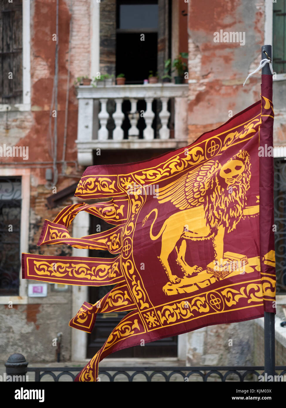 VENICE, ITALY - SEPTEMBER 12, 2017:  The Heraldic Banner Flag of the City of Venice with the City's Winged Lion of St. Marks symbol against background Stock Photo