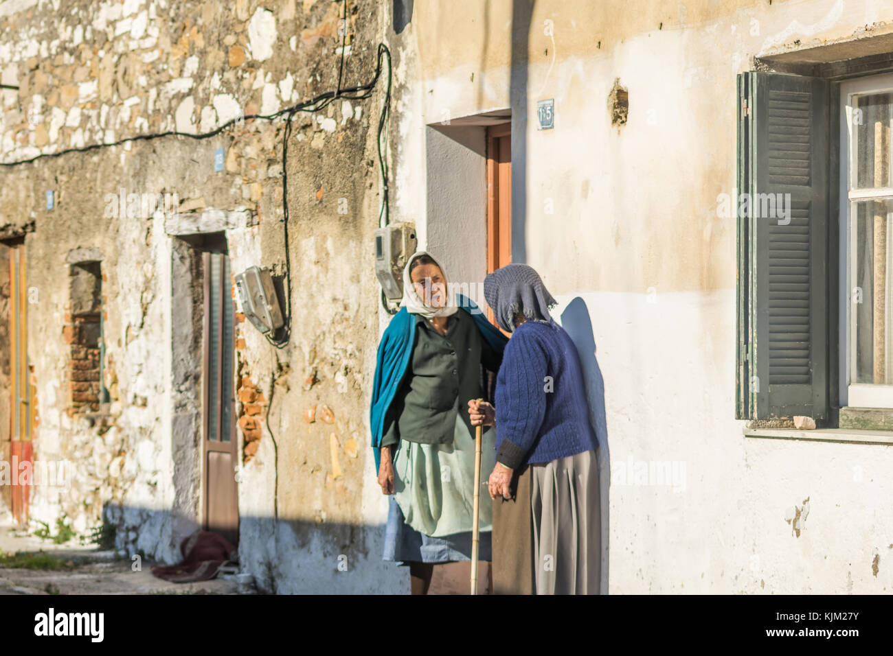 Local old ladies having a chat on the street outside their house in Lefkimmi Corfu Greece. Stock Photo