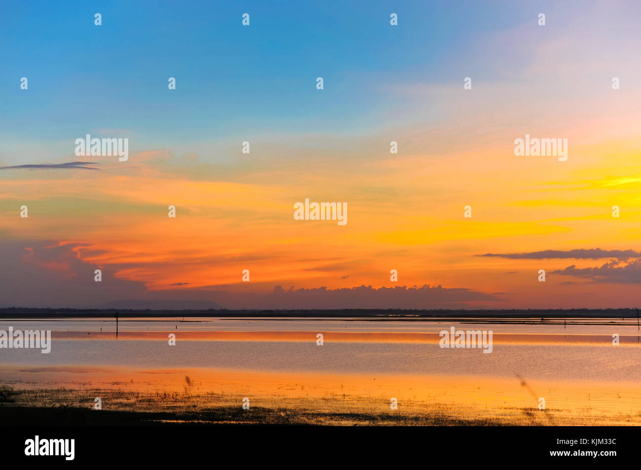 Beautiful sky clouds at sunset time over lake Stock Photo - Alamy