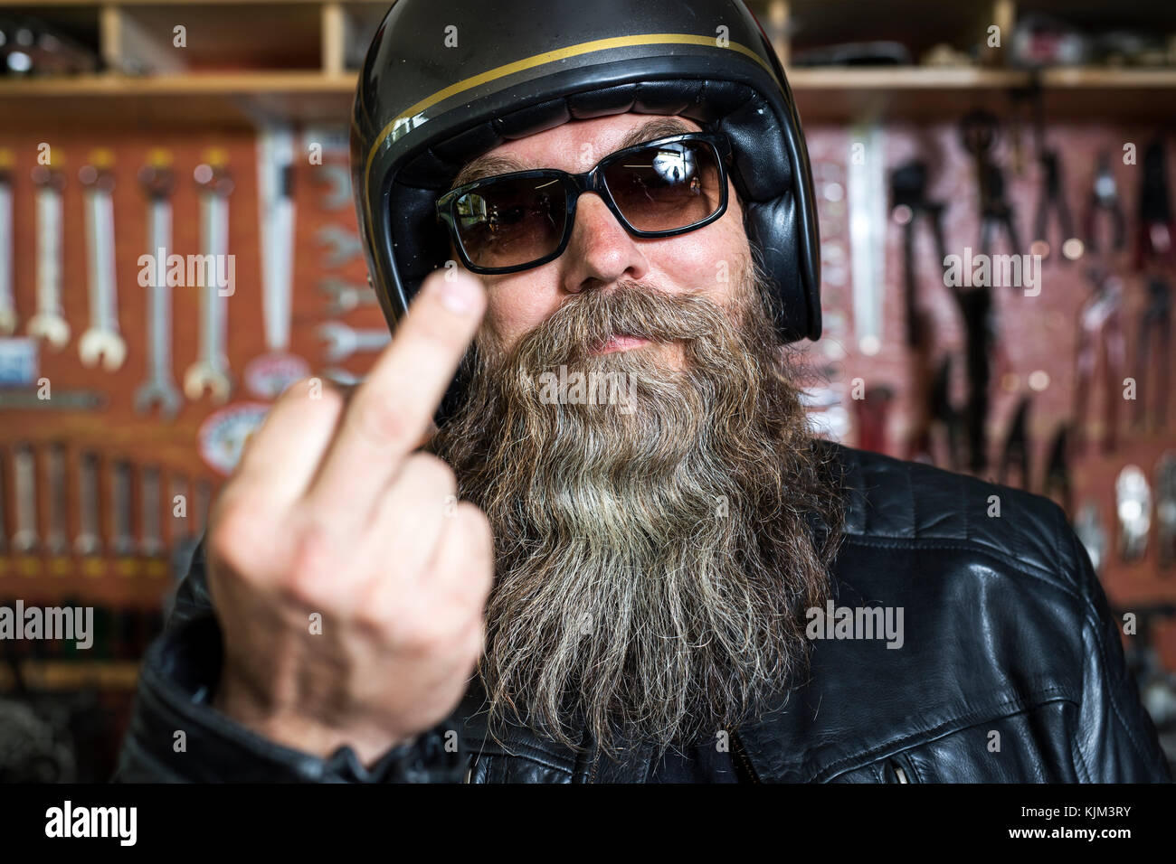 motorcycle freak in his workshop Stock Photo