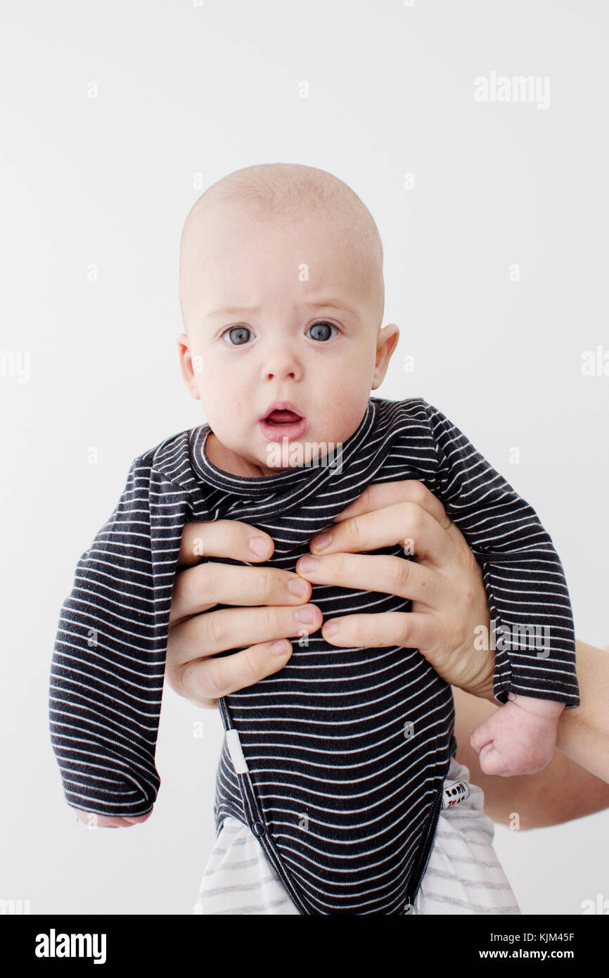 Crop person holding adorable infant Stock Photo