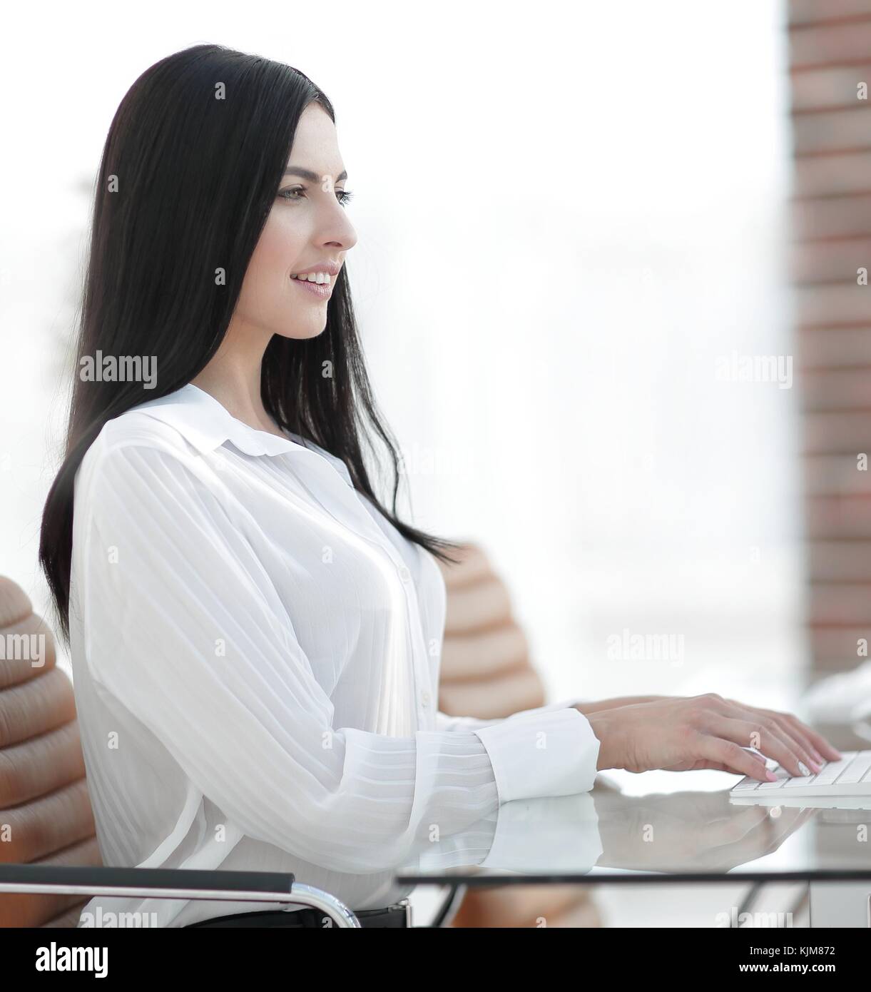 successful young business woman sitting at workplace Stock Photo - Alamy