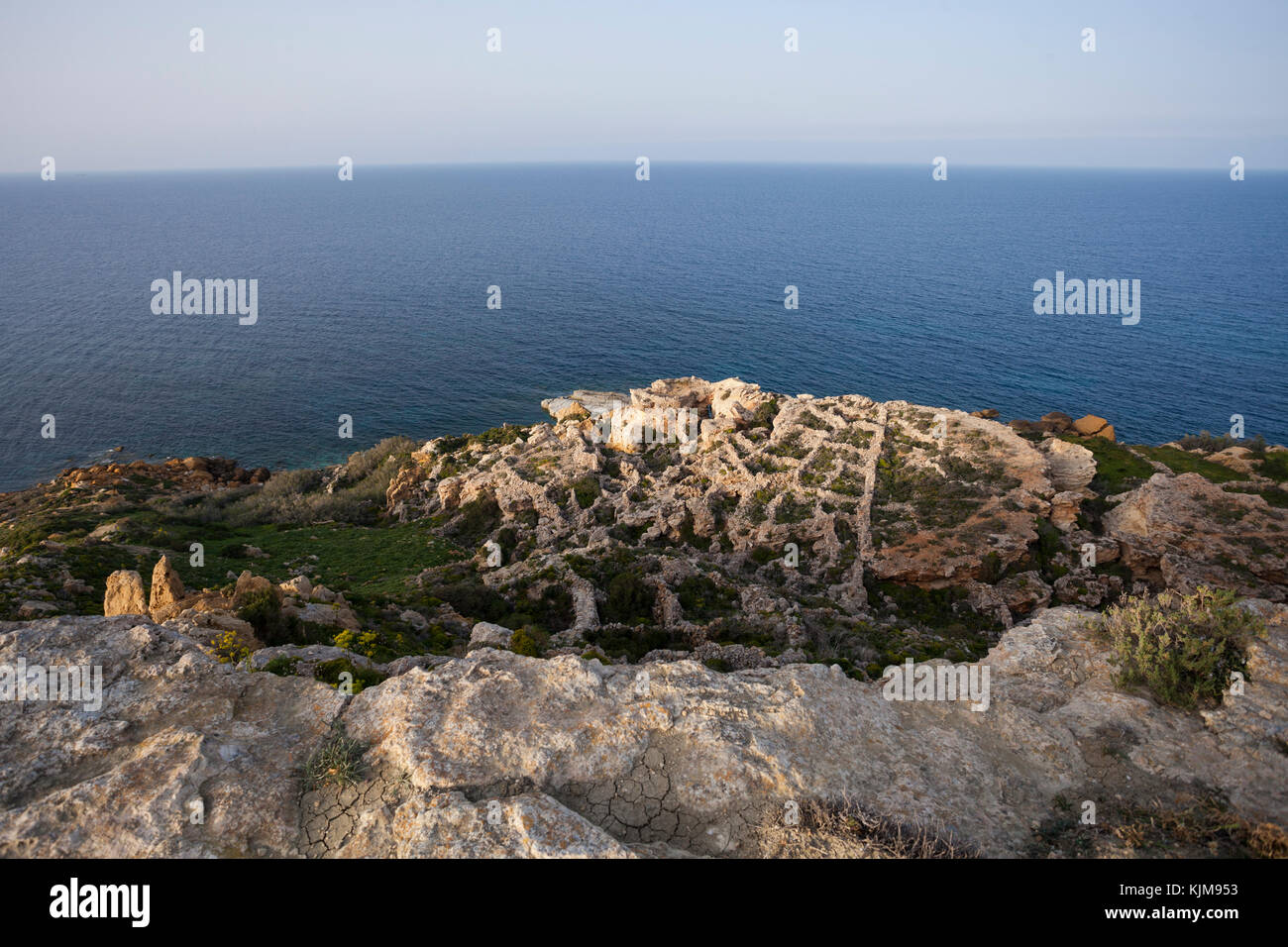 Overlooking abandoned manmade farm from northern cliff in Gozo, Malta Stock Photo