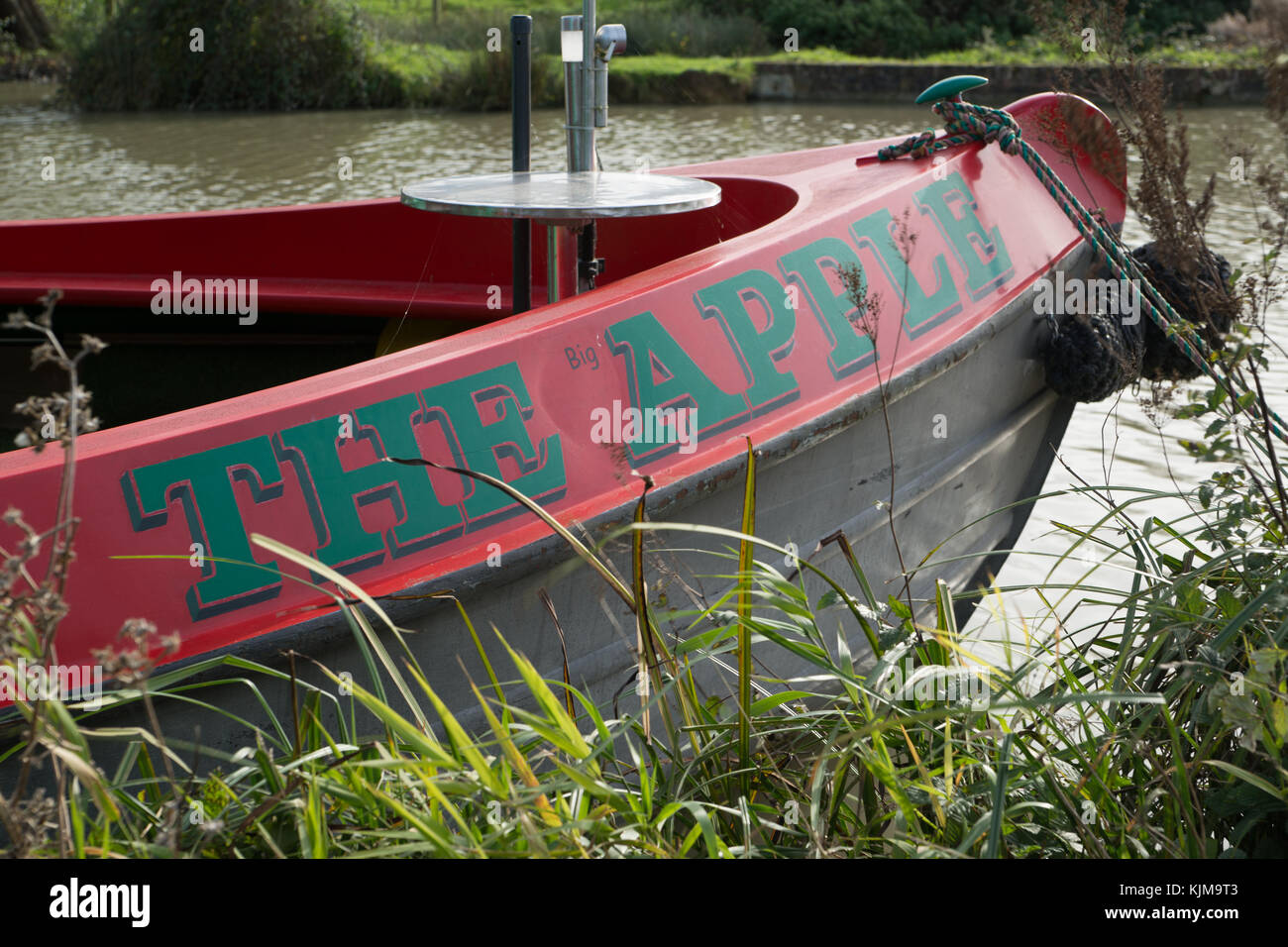 the big apple name on leisure boat Stock Photo