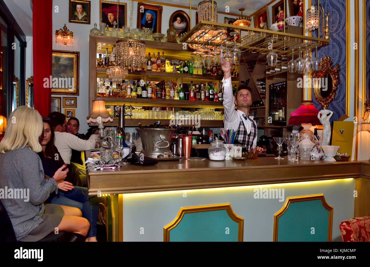 Night life with people inside Tazza Espresso - Wine bar & Bistro in central Athens, Greece Stock Photo