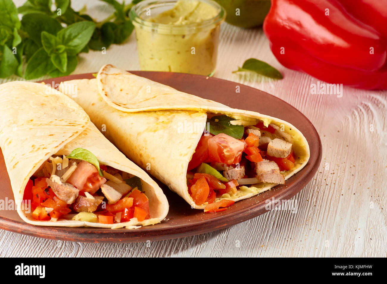 Two tortilla wraps with roasted turkey and vegetables Stock Photo