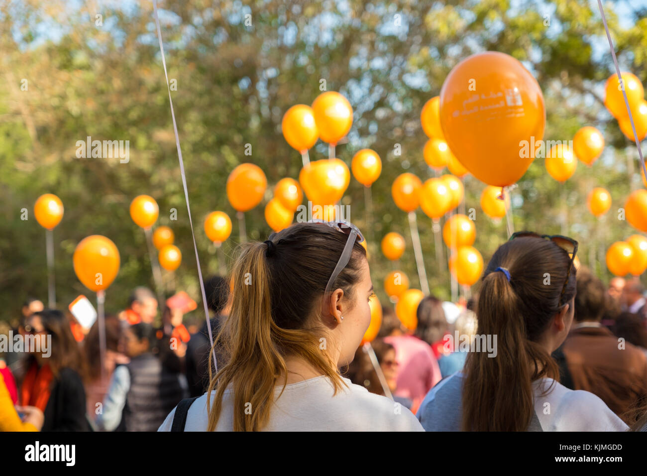 orange ballons to fight violence against women Stock Photo
