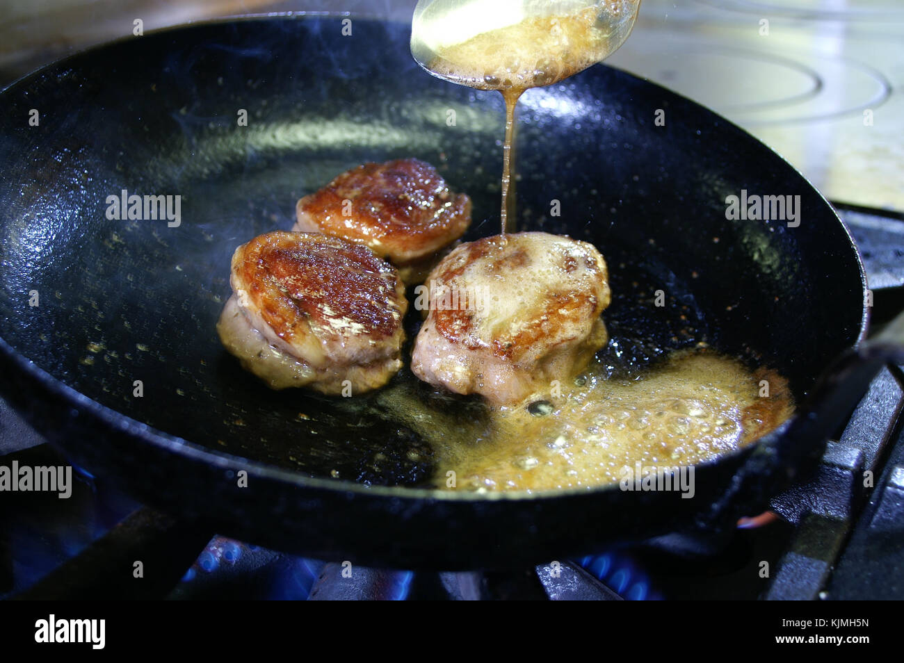 cooking pan frying lamb Stock Photo Alamy