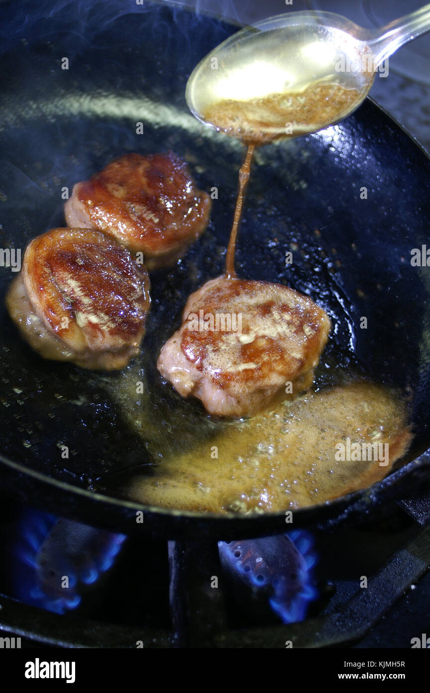 cooking pan frying lamb Stock Photo Alamy