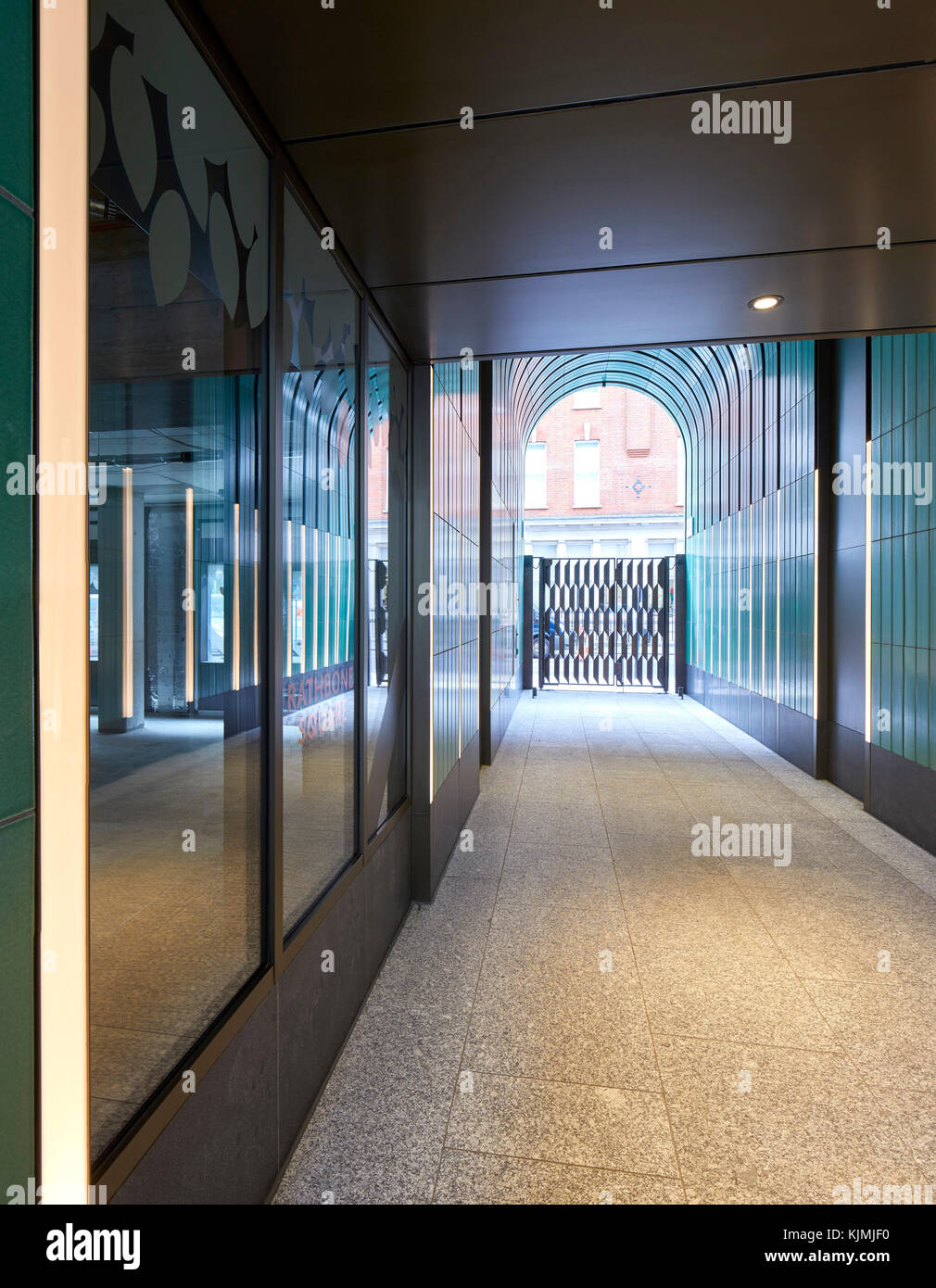 View from within pedestrian entrance tunnel. Rathbone Square, London, United Kingdom. Architect: Make Ltd, 2017. Stock Photo