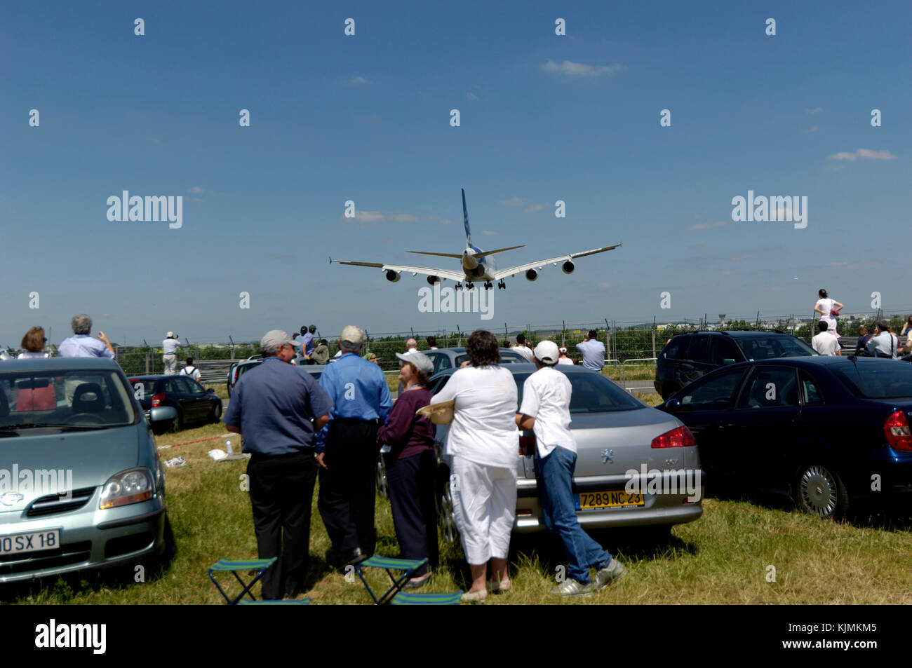 air enthusiasts watching the A380 landing after the flying-display in a carpark at the 2005 Paris AirShow, Salon-du-Bourget Stock Photo