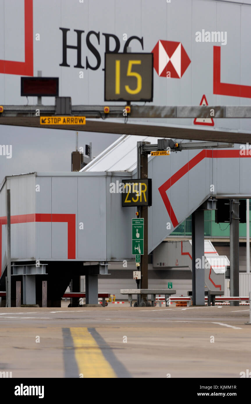 airport apron signs for gate 15 with gate 25R behind and HSBC