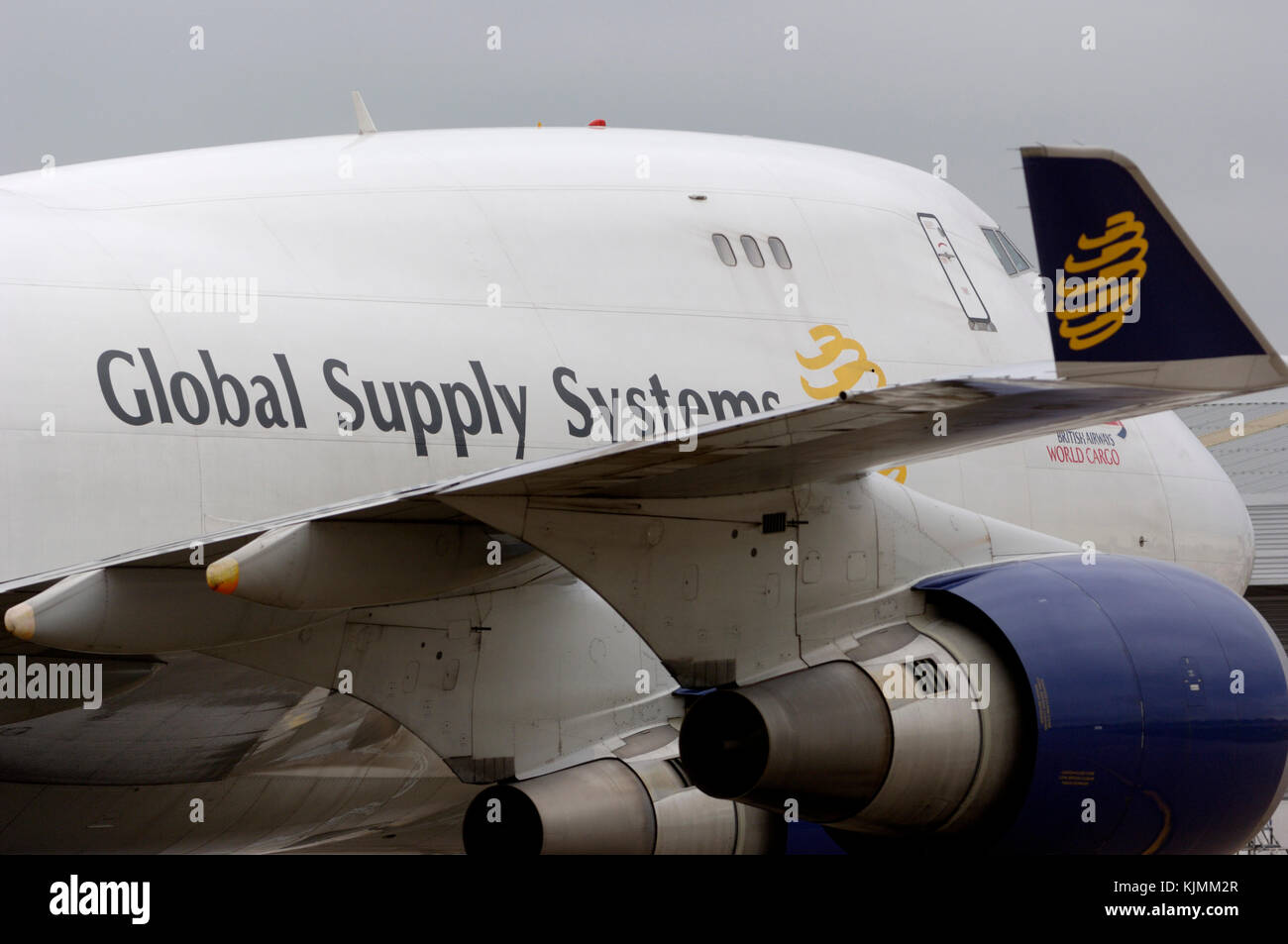 winglet with logo, engines and fuselage lump with 'operated for British Airways World Cargo' titles Stock Photo