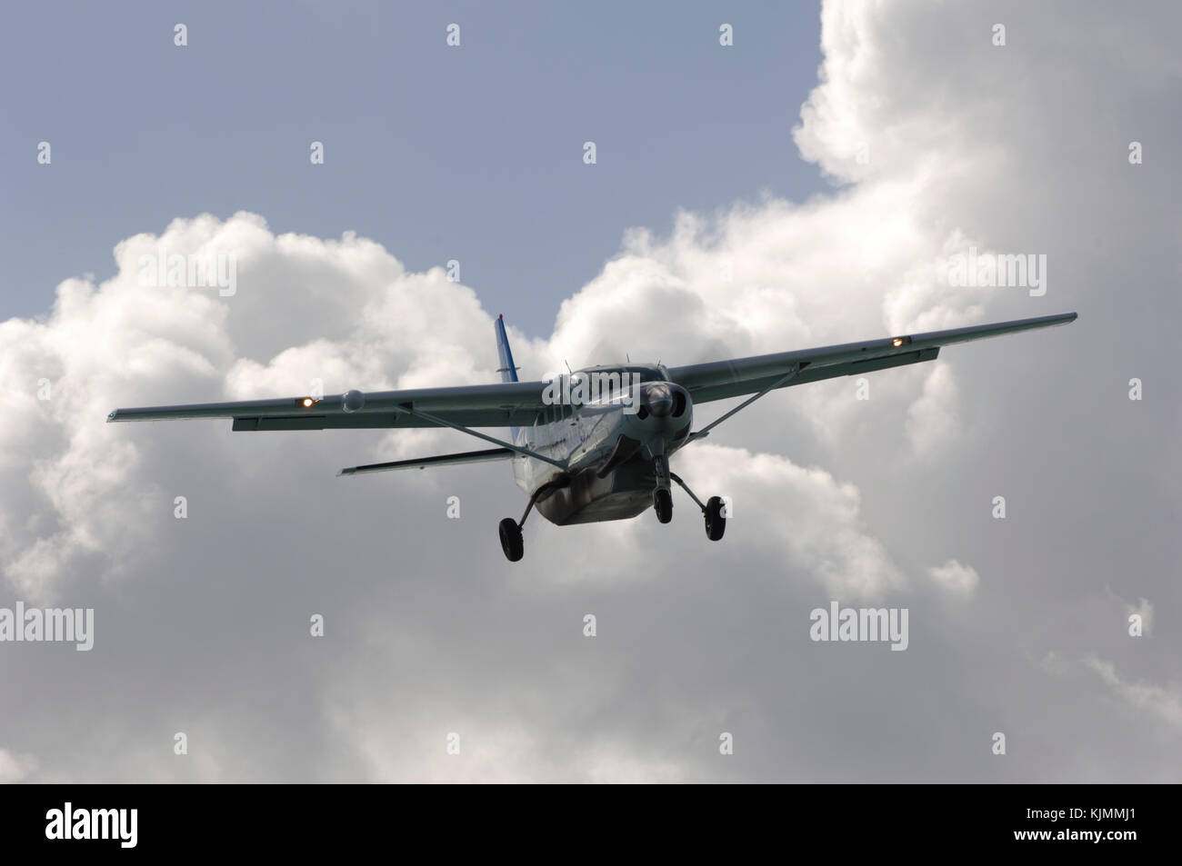 final-approach with clouds and belly-pod Stock Photo