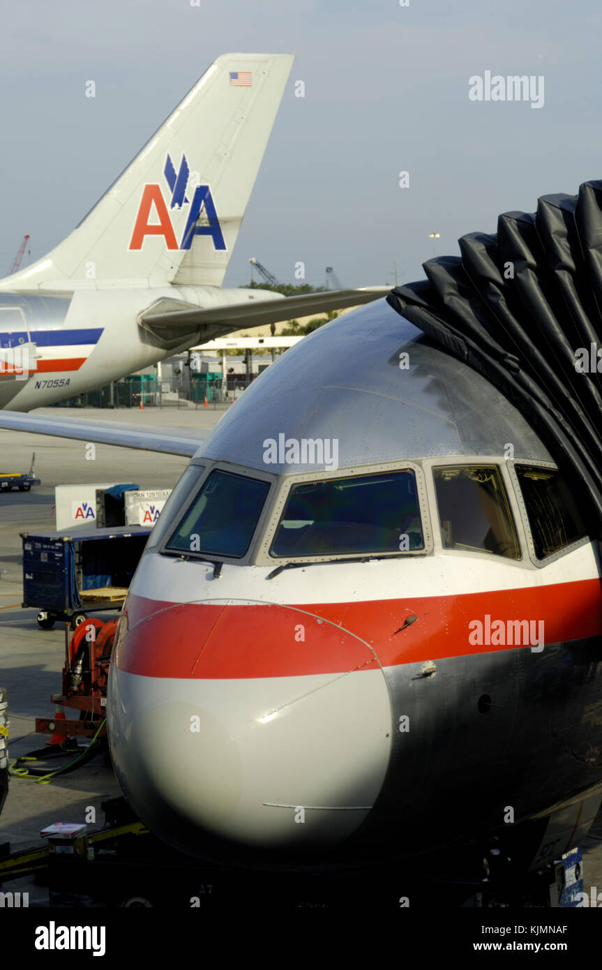 windshield of an American Airlines Boeing 757-200 with tail of an Airbus A300-600 parked behind Stock Photo