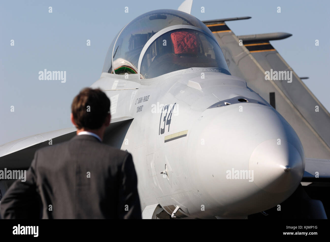 businessman looking at the US Navy USN Boeing F/A-18F Super Hornet in the static-display at the 2006 Farnborough International Airshow Stock Photo