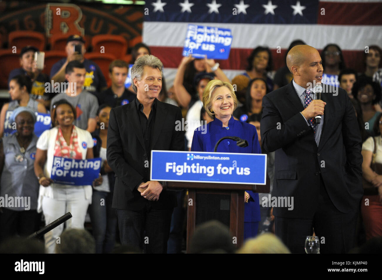 NEWARK, NJ - JUNE 01: Democratic presidential candidate Hillary Clinton speaks at a rally on June 1, 2016 in Newark, New Jersey. Clinton will head back to California tomorrow where she is in a tight race with Democratic challenger Sen. Bernie Sanders (D-VT)  People:  Jon Bon Jovi, Hillary Clinton, Cory Booker Stock Photo