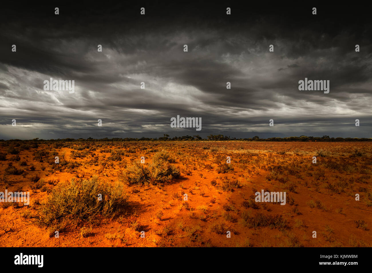 Approaching thunderstorm over Little Sandy Desert in Western Australia. Stock Photo