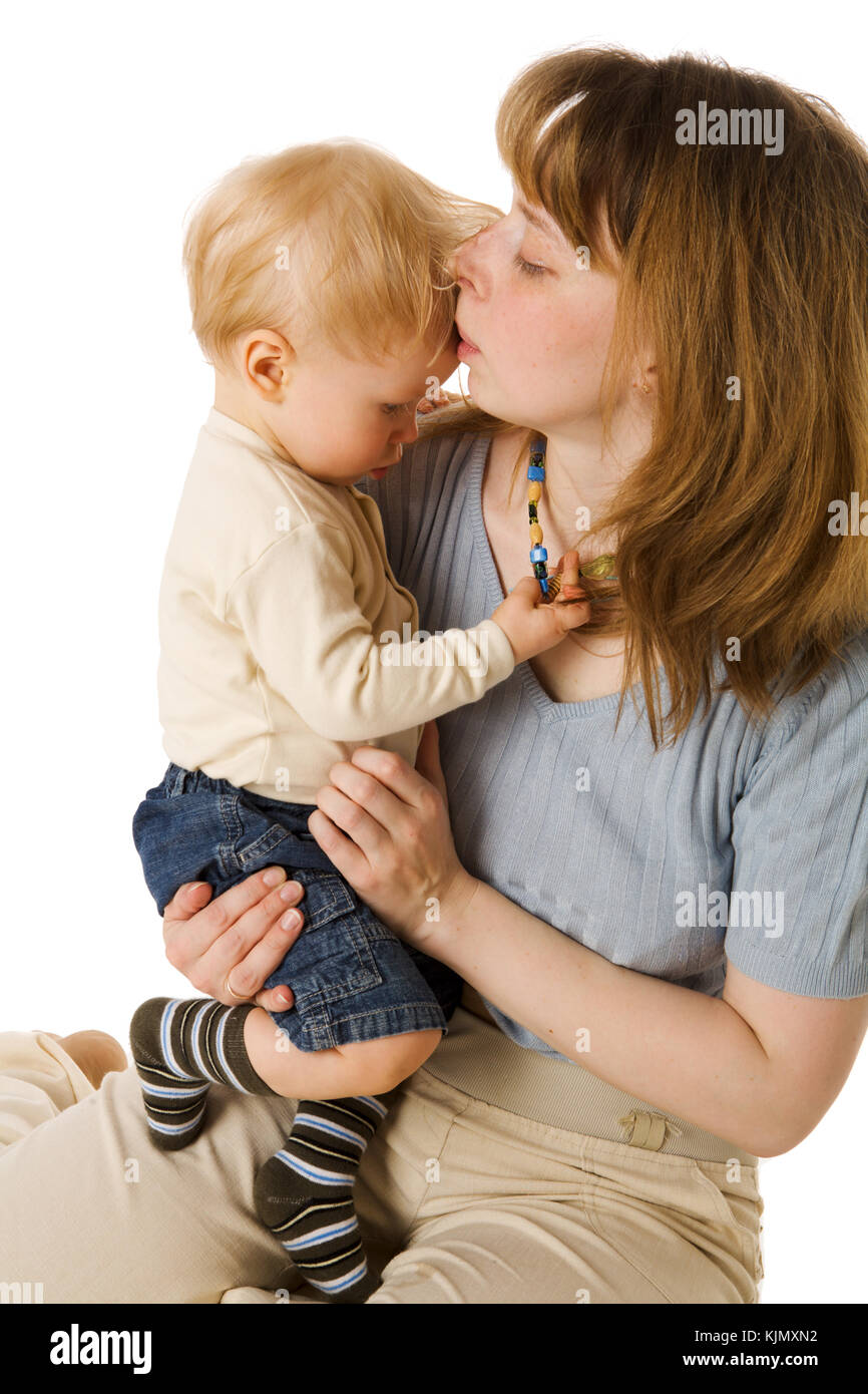 Mother kissing sick son's forehead isolated on white Stock Photo Alamy