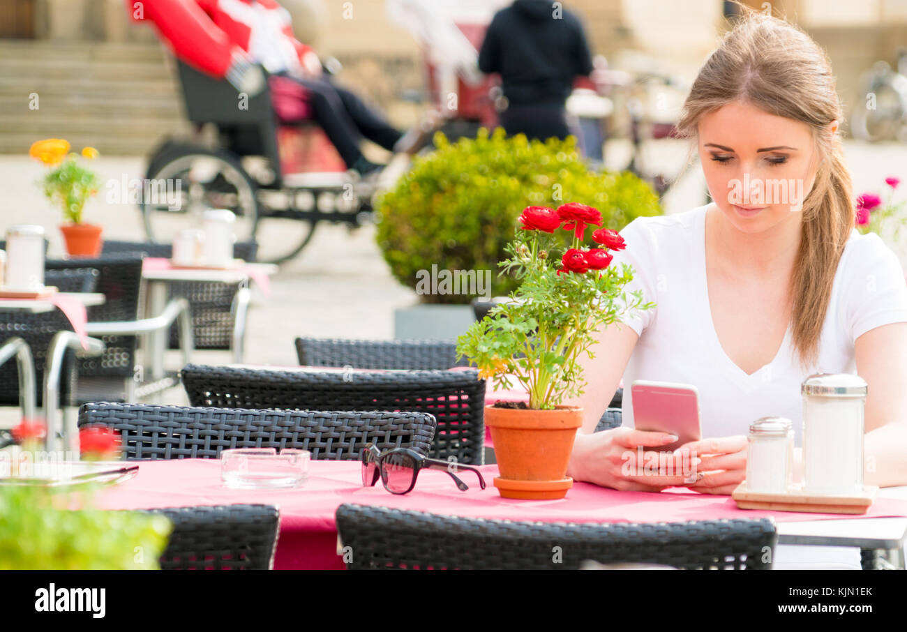 Young woman in street cafe Stock Photo - Alamy
