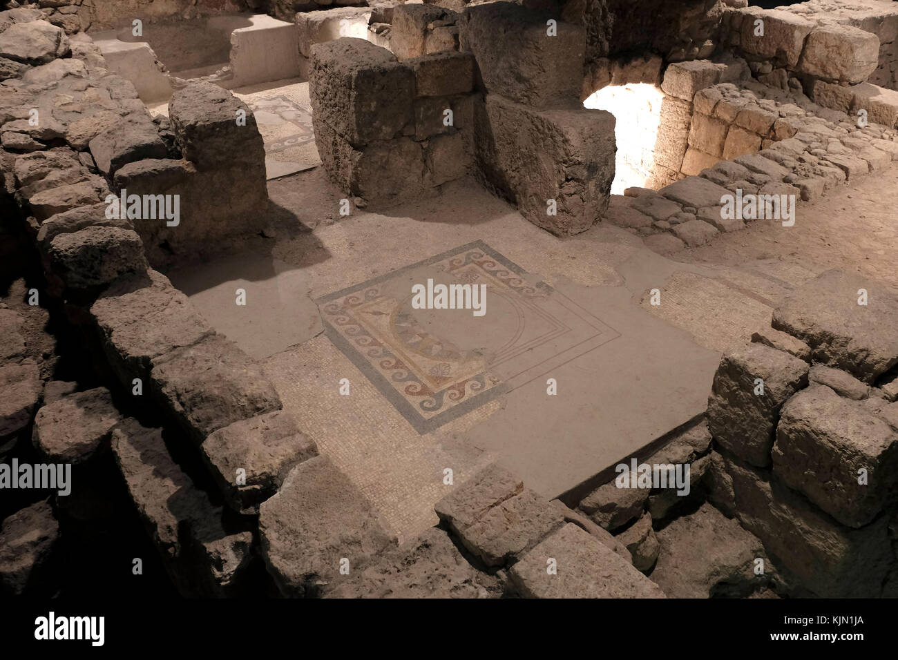 Remains of a house and a floor mosaic uncovered at the site, which was  part of a residential quarter in the time of the Herodian Dynasty (37 BCE 70 CE) located in The Wohl Museum of Archeology also called The Herodian Quarter below the level of the present Jewish Quarter in the Old City East Jerusalem Israel. Stock Photo