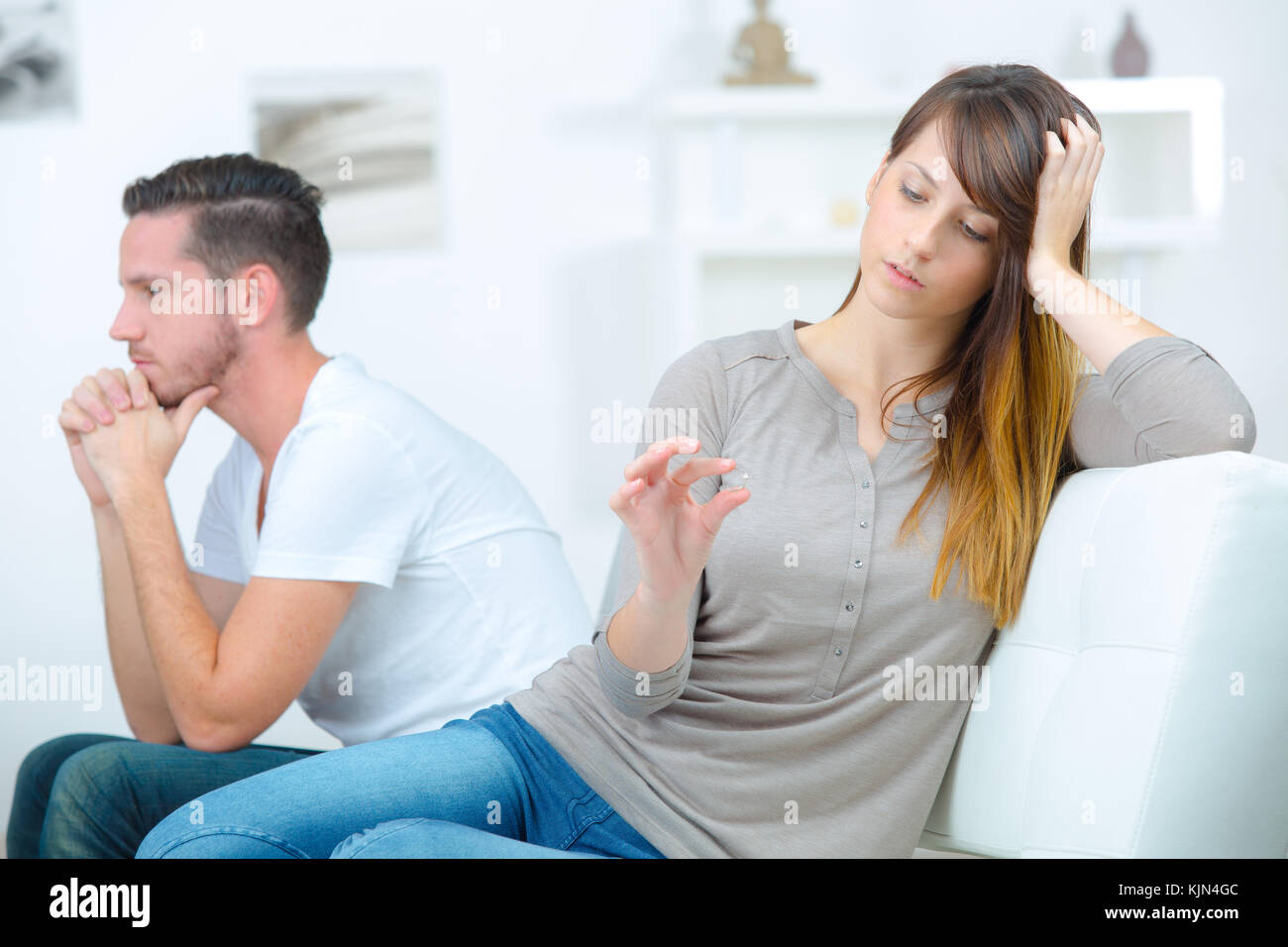 woman deciding weather to take or not morning-after pill Stock Photo